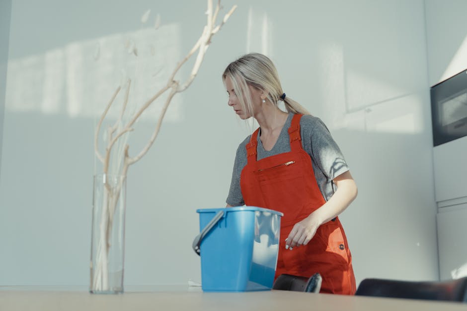 A smiling professional cleaner ready to tackle tough stains